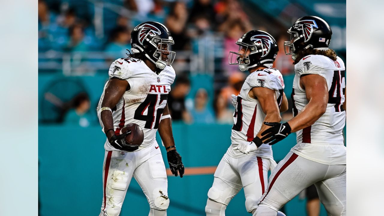 Atlanta Falcons quarterback Logan Woodside (11) runs with the ball against  the Miami Dolphins during an NFL pre-season football game, Friday, Aug. 11,  2023, in Miami Gardens, Fla. (AP Photo/Doug Murray Stock