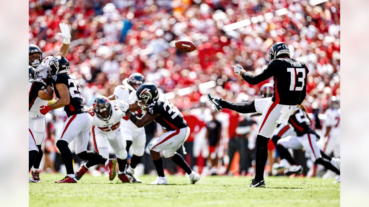 Atlanta Falcons punter Bradley Pinion (13) punts during the first half of  an NFL football game