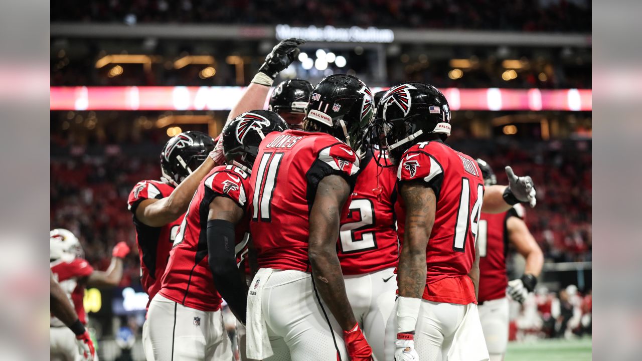 Atlanta Falcons wide receiver Justin Hardy (14) celebrates with Mohamed  Sanu (12) after his 5-yard touchdown pass over the Arizona Cardinals during  the second half of an NFL game at Mercedes-Benz Stadium