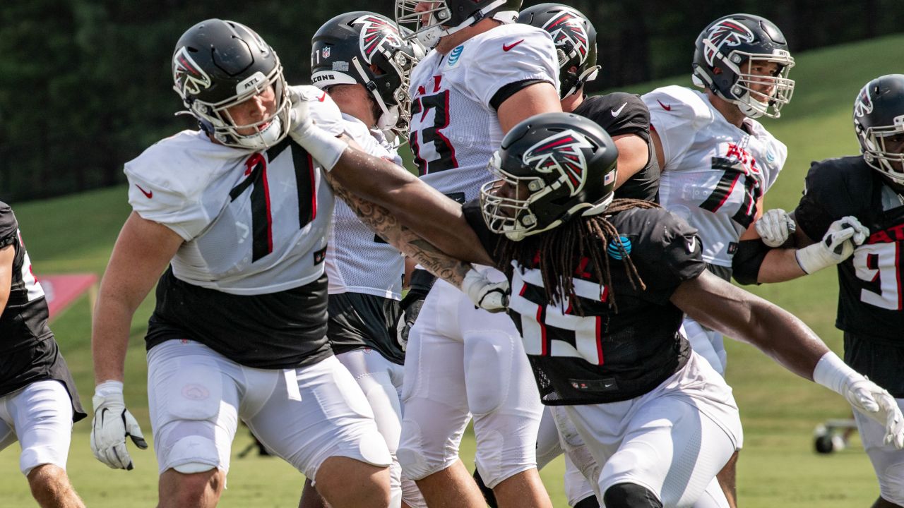 Atlanta Falcons offensive tackle Jalen Mayfield (77) works during