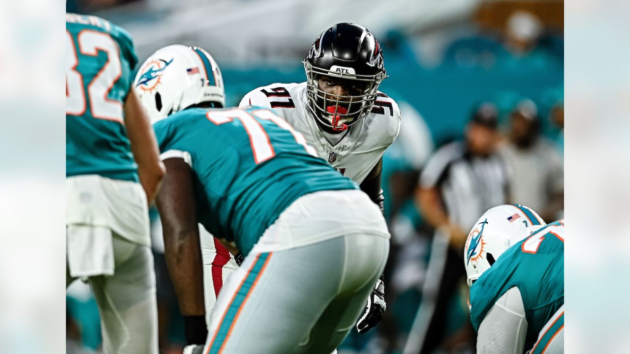 Atlanta Falcons quarterback Logan Woodside (11) runs with the ball against  the Miami Dolphins during an NFL pre-season football game, Friday, Aug. 11,  2023, in Miami Gardens, Fla. (AP Photo/Doug Murray Stock