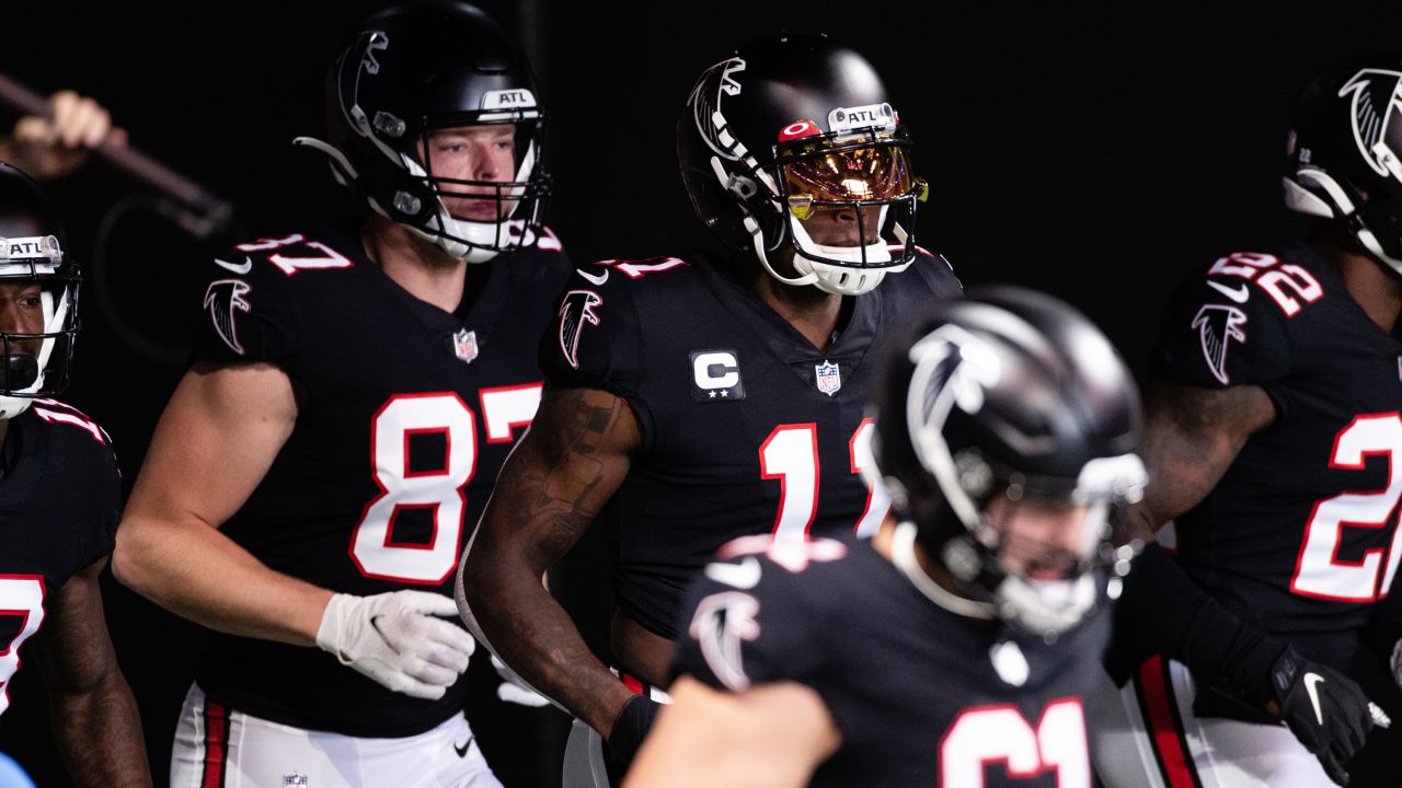 Atlanta Falcons wide receiver Christian Blake #13 runs out of the tunnel  during pregame against the …