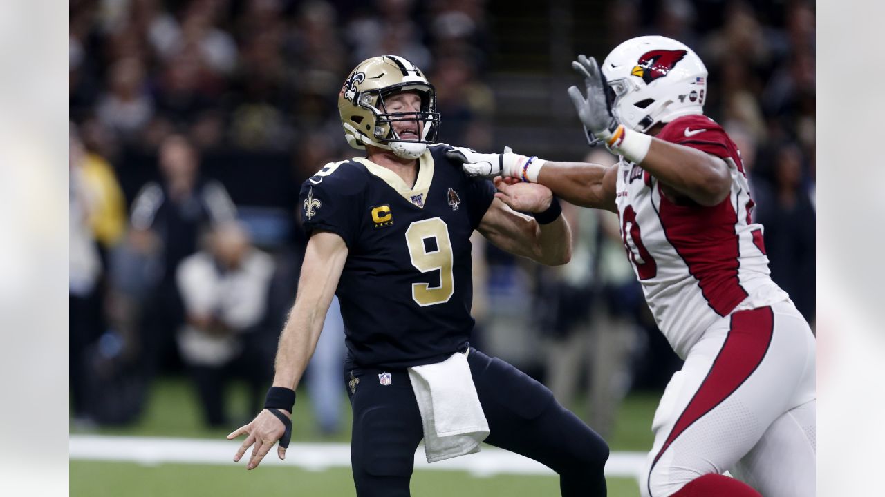 A detail shot of New Orleans Saints quarterback Drew Brees #9 cleats as he  walks on the field between plays against the Las Vegas Raiders during an  NFL football game, Monday, Sept.