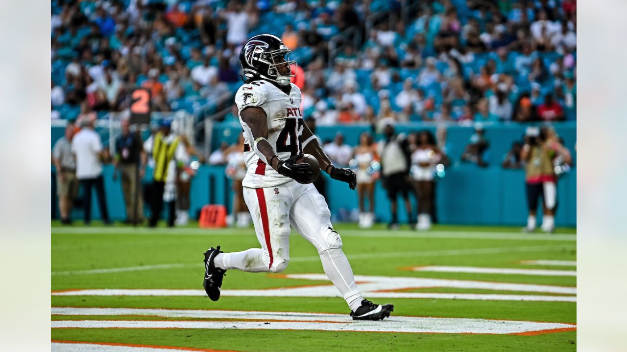 Atlanta Falcons quarterback Logan Woodside (11) runs with the ball against  the Miami Dolphins during an NFL pre-season football game, Friday, Aug. 11,  2023, in Miami Gardens, Fla. (AP Photo/Doug Murray Stock