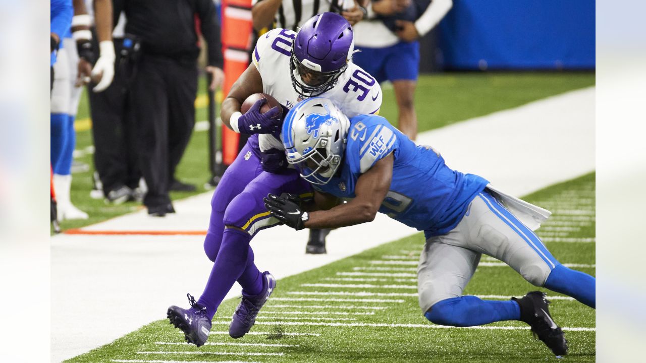 Minnesota Vikings fullback C.J. Ham (30) runs with the ball during the  first half of an NFL football game against the Chicago Bears, Sunday, Jan.  8, 2023, in Chicago. (AP Photo/Kamil Krzaczynski