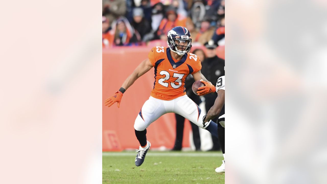 Raiders running back Devontae Booker (23) warms up before the start of an  NFL football game aga …