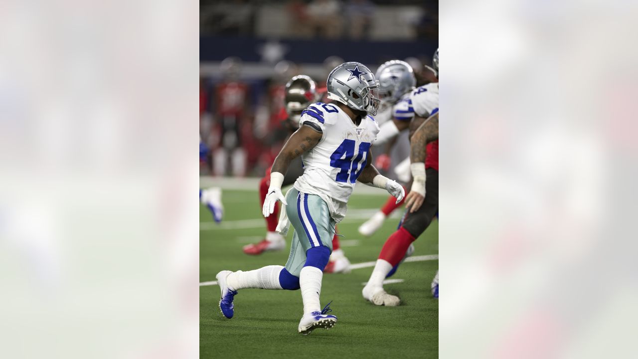 Dallas Cowboys defensive end Taco Charlton (97) watches the team work out  from the sideline at the team's NFL football training facility in Frisco,  Texas, Tuesday, June 11, 2019. (AP Photo/Tony Gutierrez