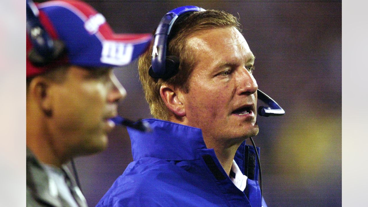 New York Giants head coach Jim Fassel wears his 2000 Super Bowl