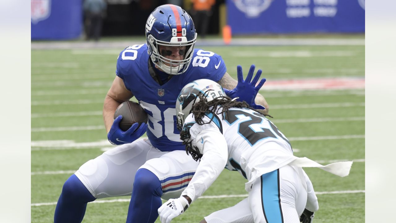 New York Giants outside linebacker Azeez Ojulari (51) and New York Giants  defensive end Leonard Williams (99) react against the Carolina Panthers  during an NFL football game, Sunday, Oct. 24, 2021, in