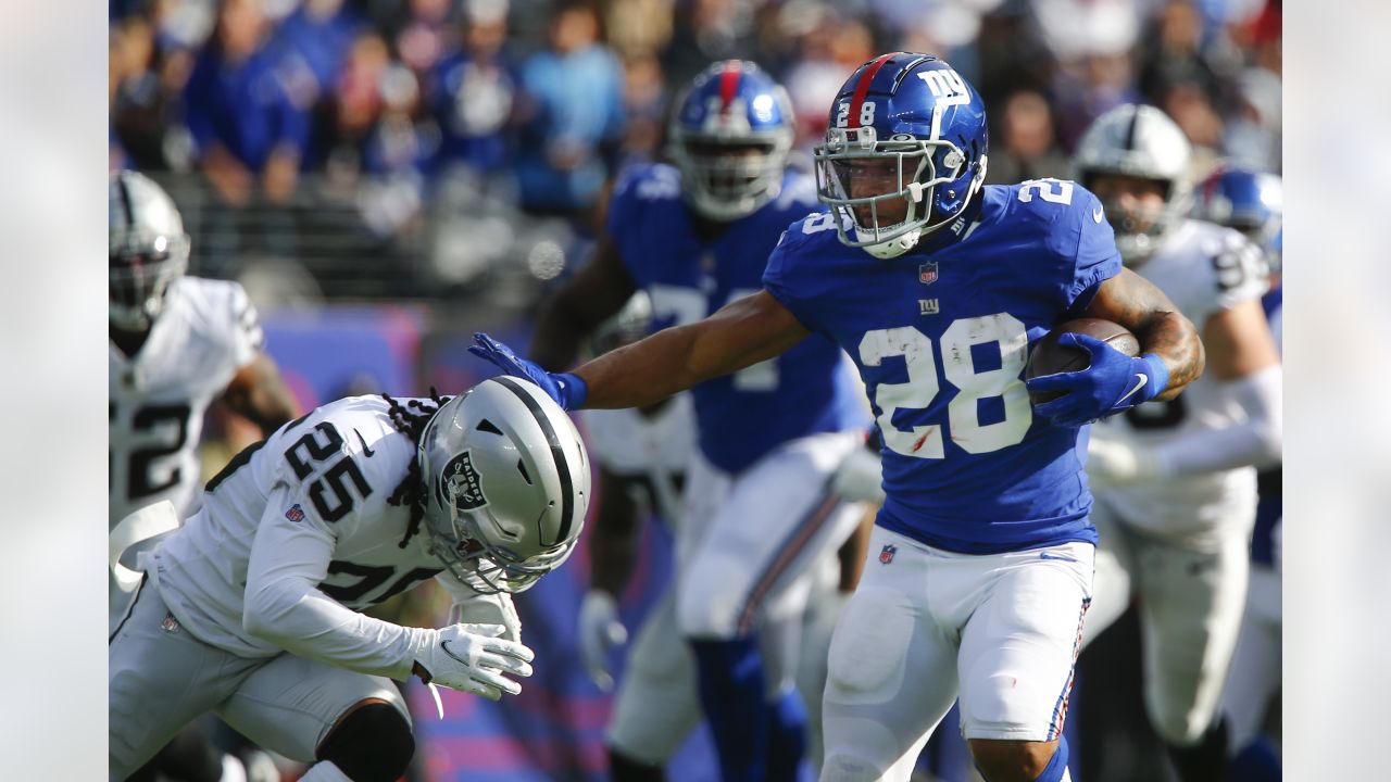 Las Vegas Raiders free safety Trevon Moehrig (25) takes down Kansas City  Chiefs running back Derrick