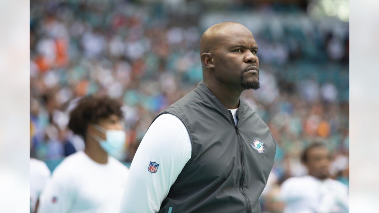 Miami Dolphins guard Michael Deiter (63) carries a football as he warms up  on the field before an NFL football game against the Buffalo Bills, Sunday,  Sept. 19, 2021, in Miami Gardens