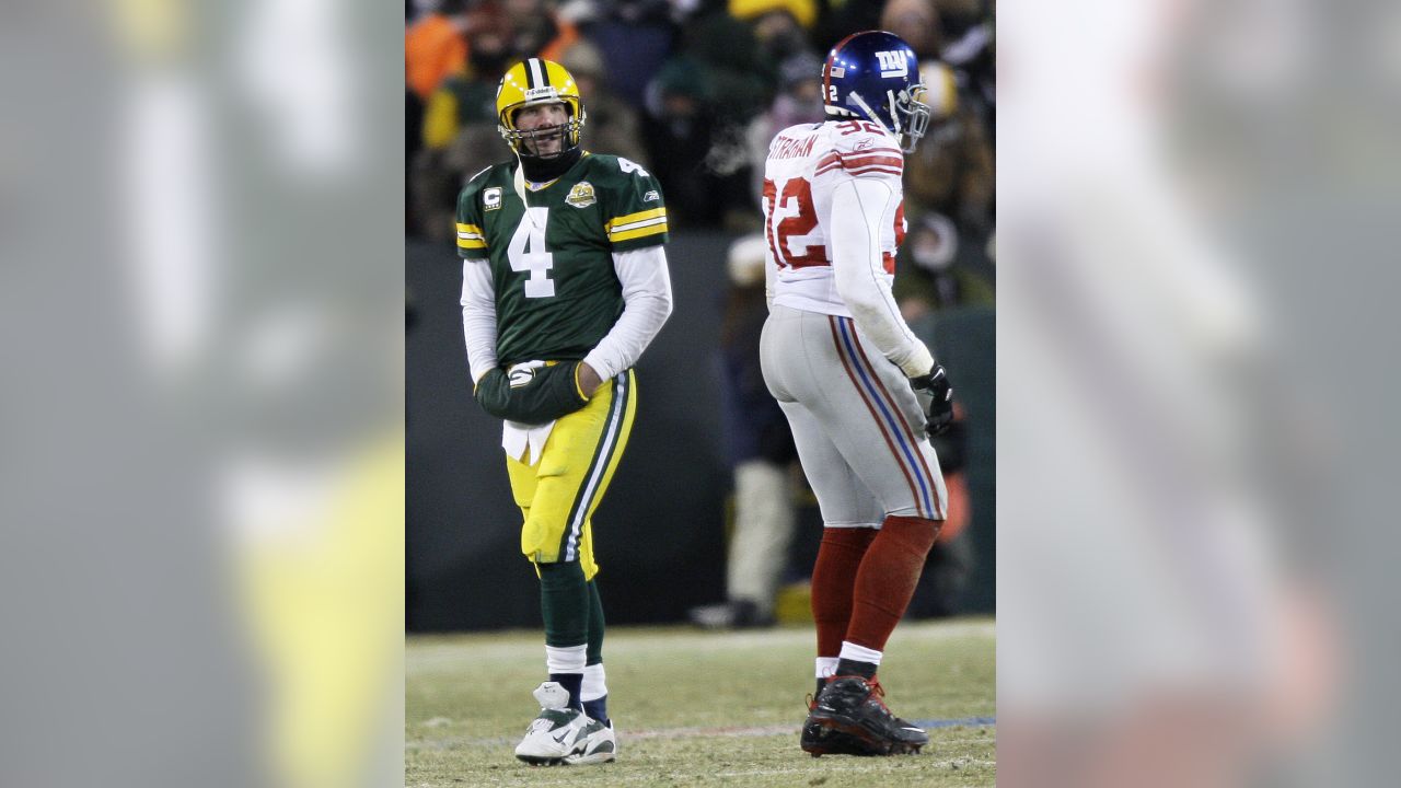 New York Giants Michael Strahan points his finger in the air and winks  while walking off of the field in week 13 at Giants Stadium in East  Rutherford, New Jersey on December