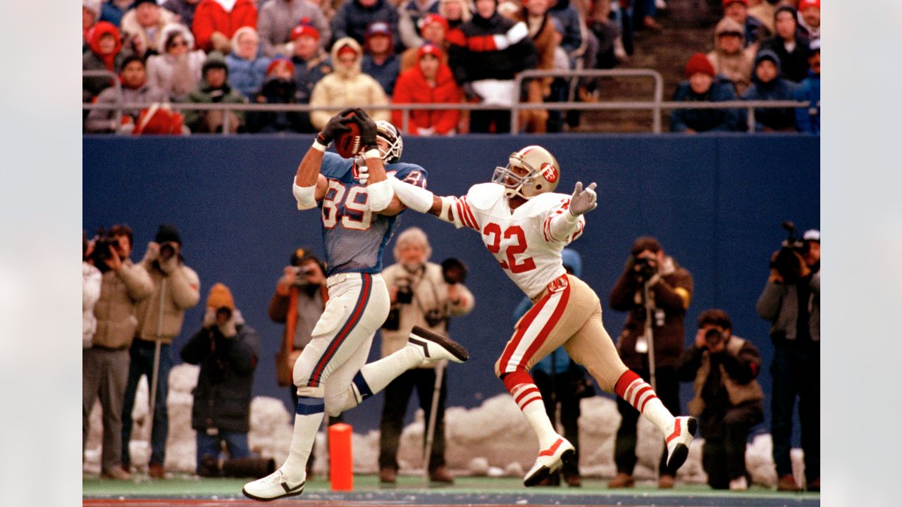 New York Giants Phil McConkey hauls in a 28-yard pass from quarterback Phil  Simms in the end zone as San Francisco 49ers Tim McKyer hangs on during  third quarter action at Giants