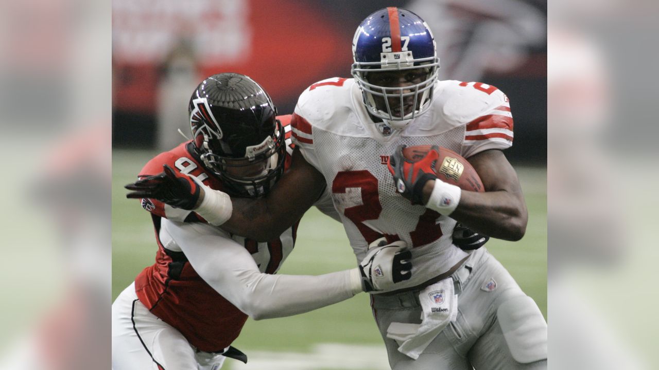 Photo: New York Giants Michael Boley grabs the jersey of Atlanta