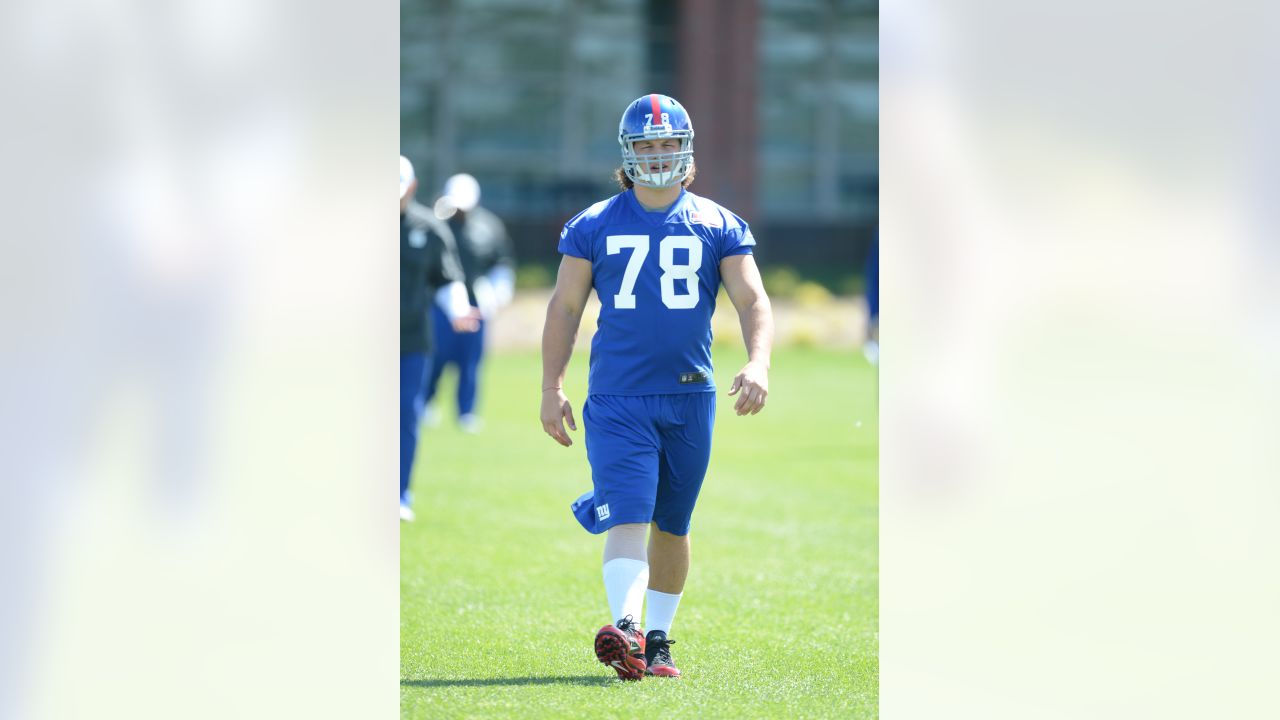 New York Giants defensive tackle Markus Kuhn (78) is fired up after an  interception by a teammate in an NFL football game between the New York  Giants and Dallas Cowboys on Sunday