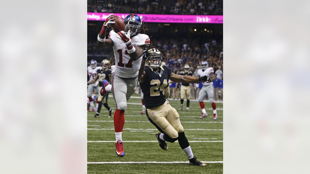 New Orleans Saints Drew Brees stretches on the sidelines before the game  against the New York Giants in week 4 of the NFL season at MetLife Stadium  in East Rutherford, New Jersey