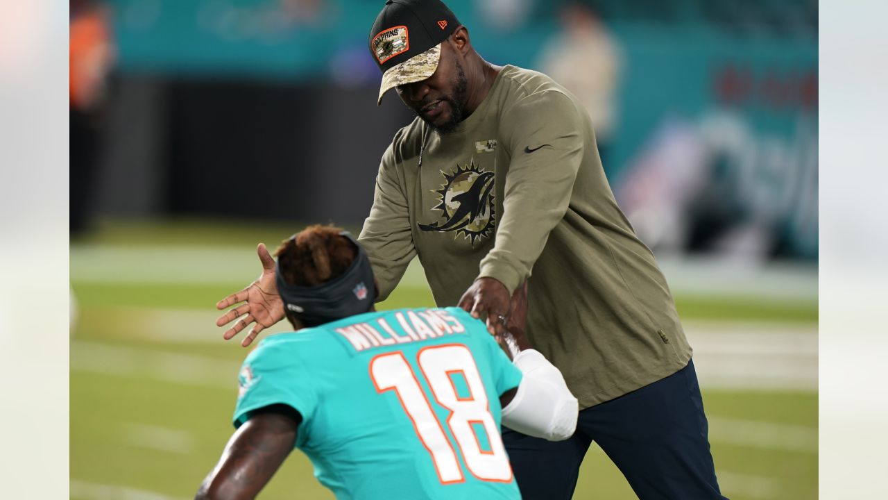 Miami Dolphins guard Michael Deiter (63) heads onto the field for warmups  before the start of a NFL preseason football game against the Las Vegas  Raiders, Saturday, Aug. 20, 2022, in Miami