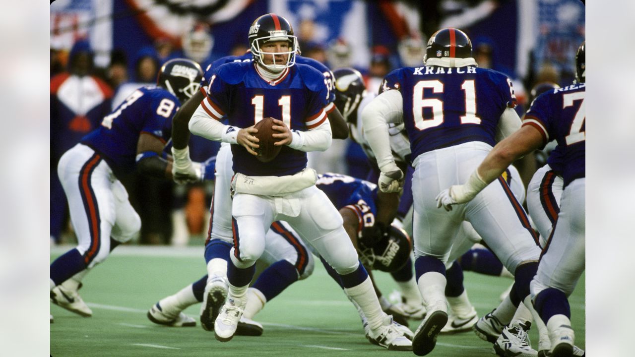 Buffalo Bills quarterback Rob Johnson (11) gets off a pass as he is is  taken down by New England Patriots defensive end Greg Spires (94) during  the first half of the game