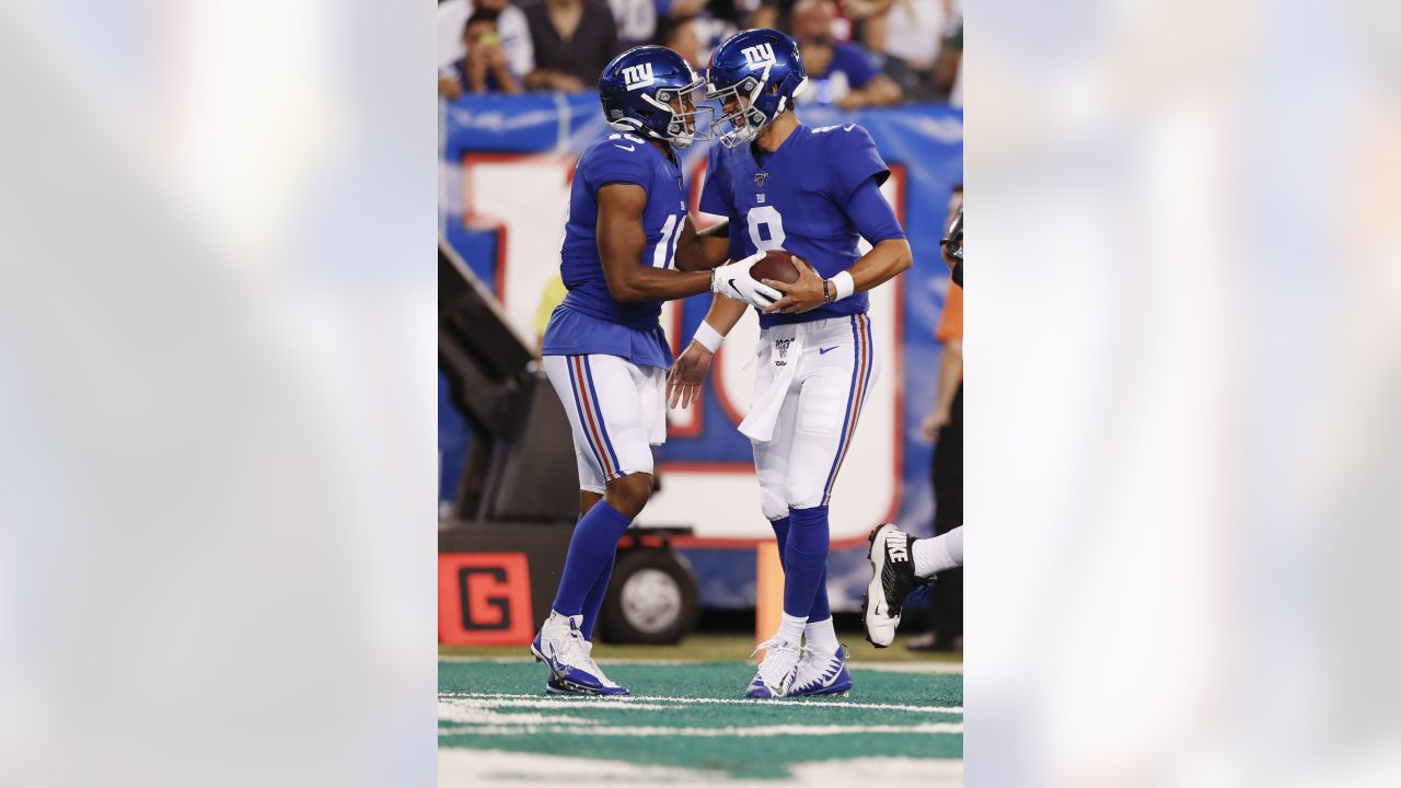 New York Giants linebacker Michael Boley (59) celebrates with safety Kenny  Phillips (21) after Phillips broke up a passing play during first half NFL  action between the New York Giants and the