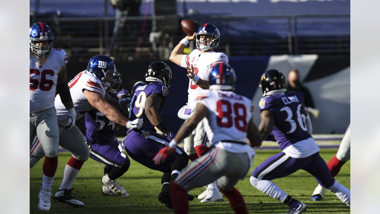 Baltimore, United States. 27th Dec, 2020. New York Giants quarterback  Daniel Jones (8) leaves the field with tight end Kaden Smith (82) after a  game against the Baltimore Ravens at M&T Bank