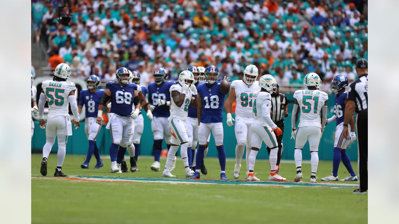 Miami Gardens, Florida, USA. 9th Dec, 2018. The Miami Dolphins players  celebrate the final touchdown, in the last few seconds, against the New  England Patriots in an NFL game at the Hard