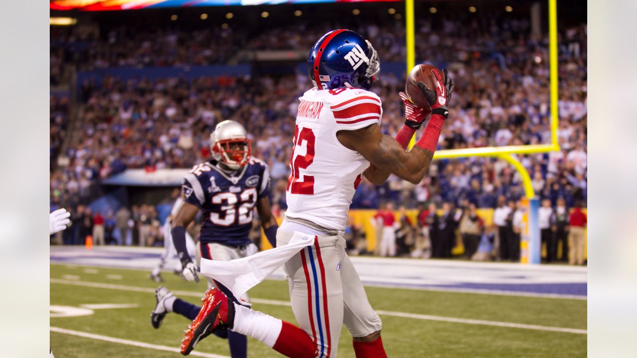 New York Giants - Super Bowl Football New York Giants Victor Cruz (80), and  Hakeem Nicks hoist up the Vince Lombardi Trophy after winning the NFL Super  Bowl XLVI football game against