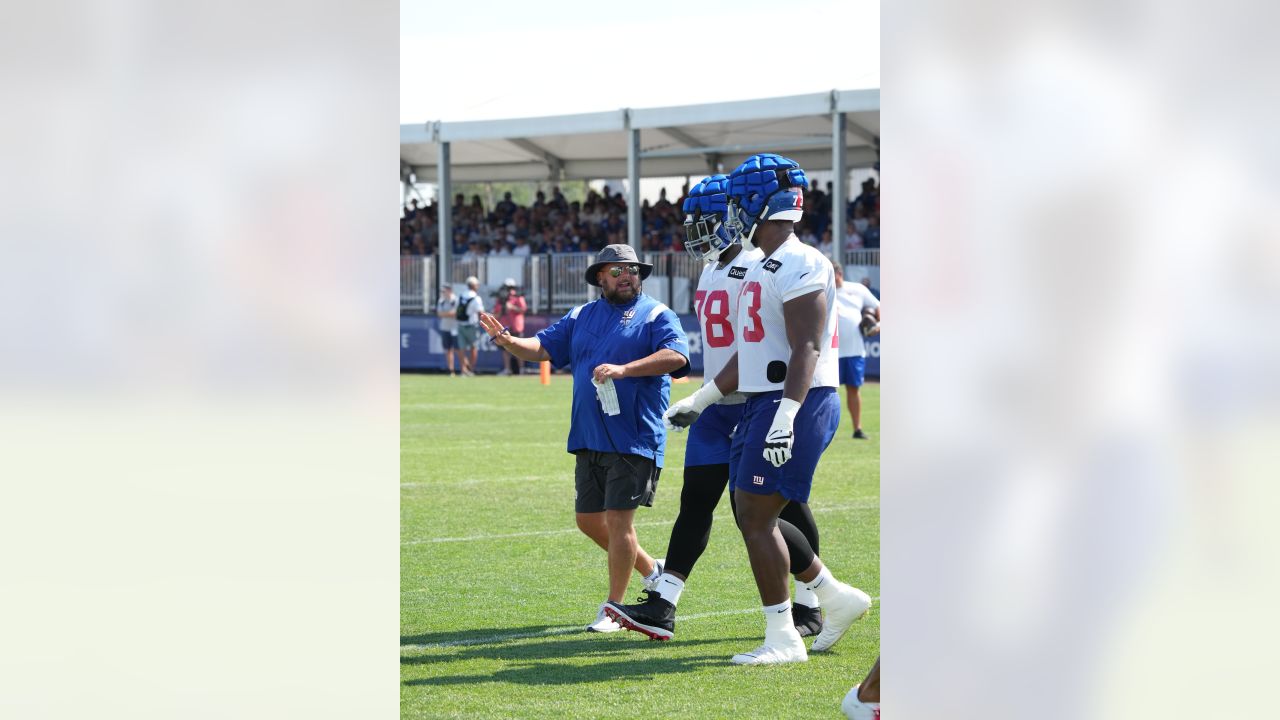 New York Giants tackle Evan Neal #73 walks off the field after