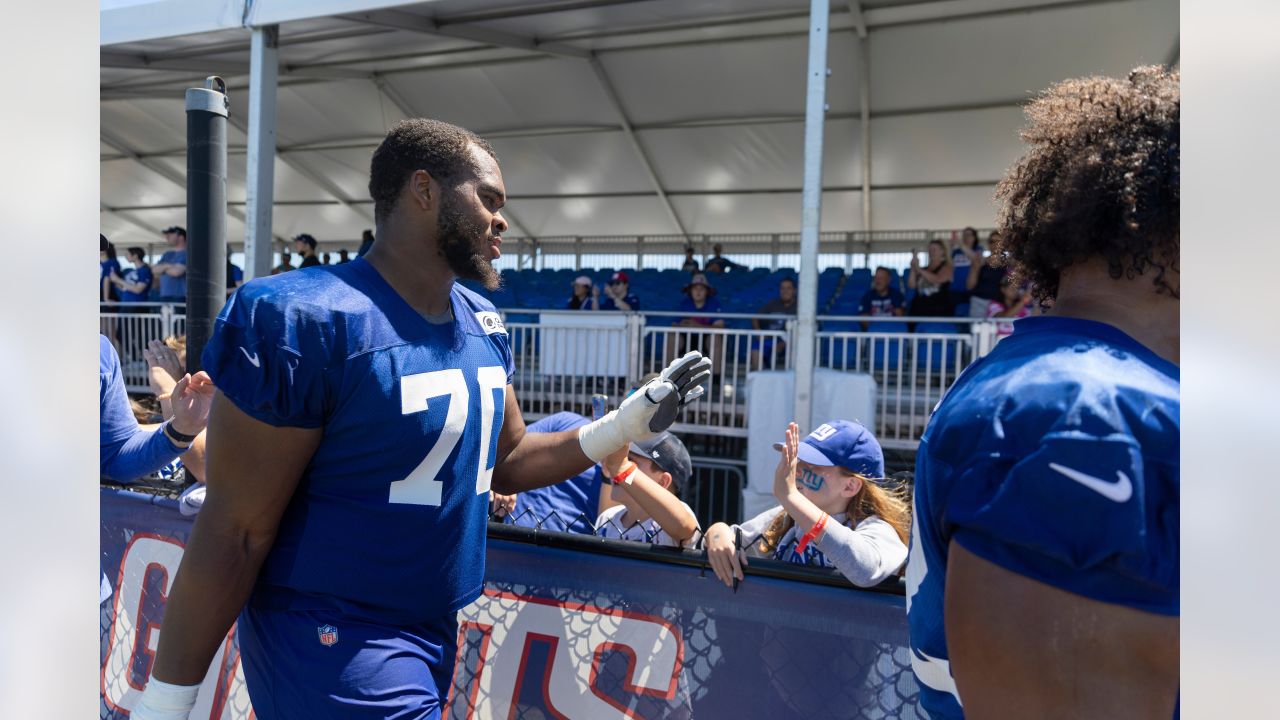 New York Giants tackle Evan Neal #73 walks off the field after their 31-27  loss to the New York Jets in an NFL pre-season football game, Sunday, Aug.  27, 2022, in East