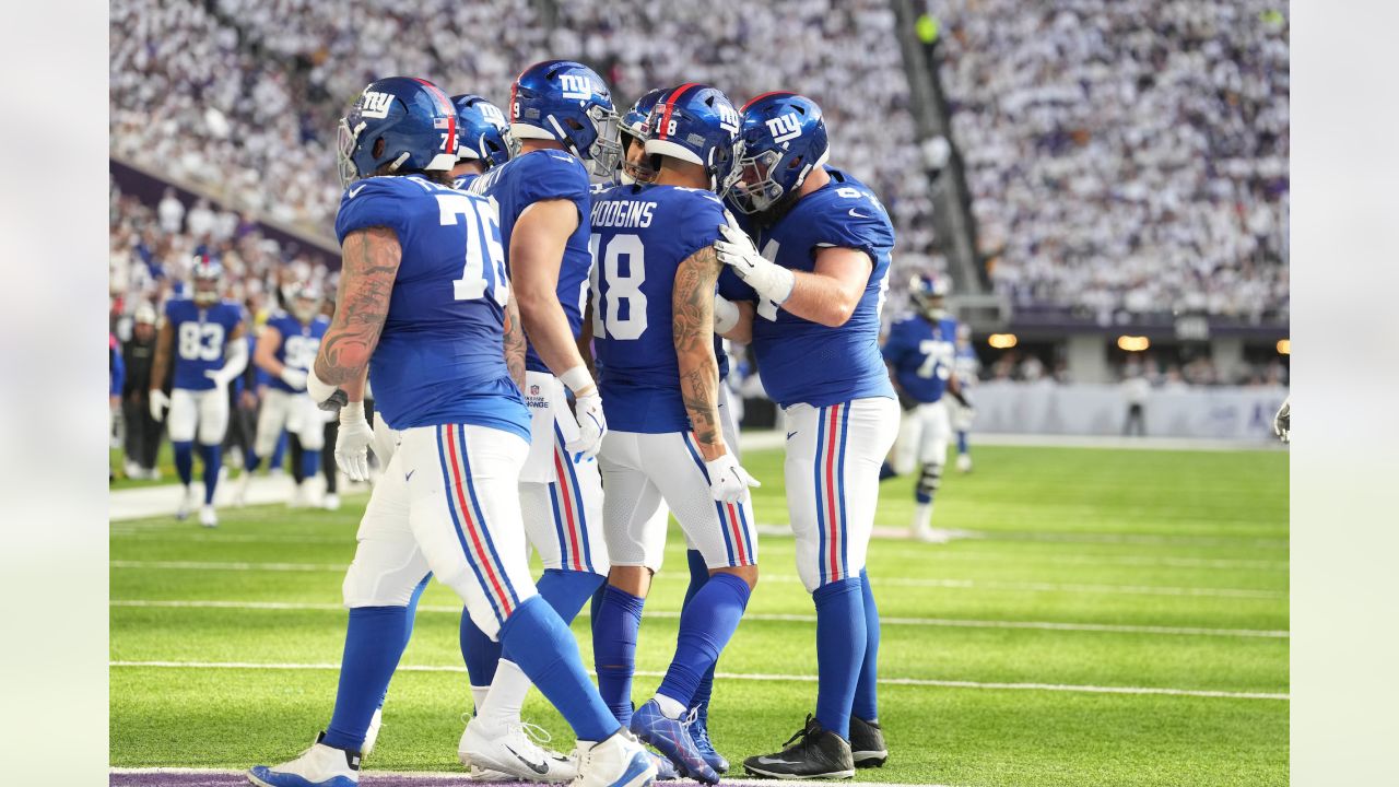 New York Giants' Isaiah Hodgins catches a touchdown pass during the second  half of an NFL football game against the Washington Commanders, Sunday, Dec.  4, 2022, in East Rutherford, N.J. (AP Photo/John