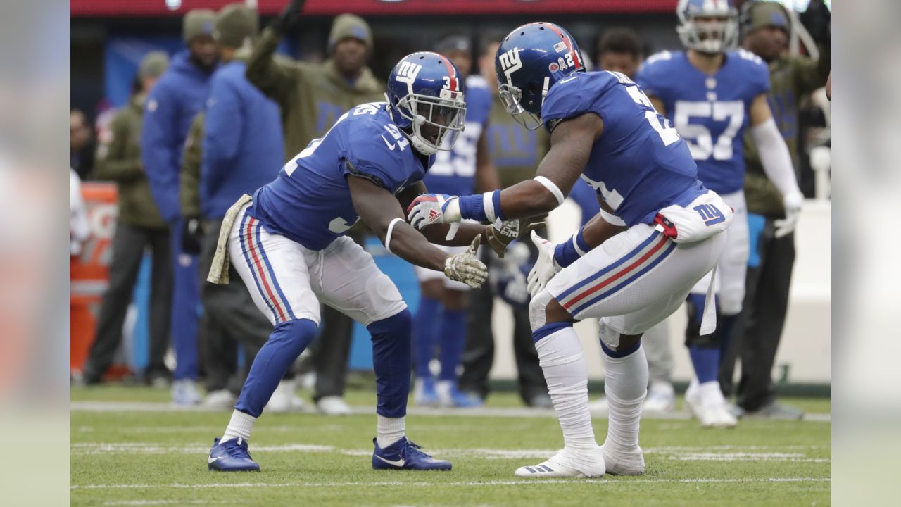 New York Giants' Michael Thomas, center, celebrates an interception with  his teammates during the first half of an NFL football game against the  Tampa Bay Buccaneers, Sunday, Nov. 18, 2018, in East