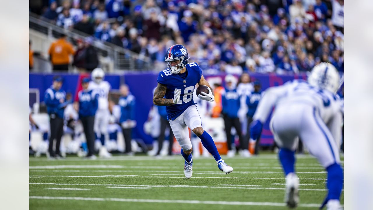 New York Giants wide receiver Isaiah Hodgins (18) runs with the ball  against the Washington Commanders during an NFL football game Sunday, Dec.  4, 2022, in East Rutherford, N.J. (AP Photo/Adam Hunger