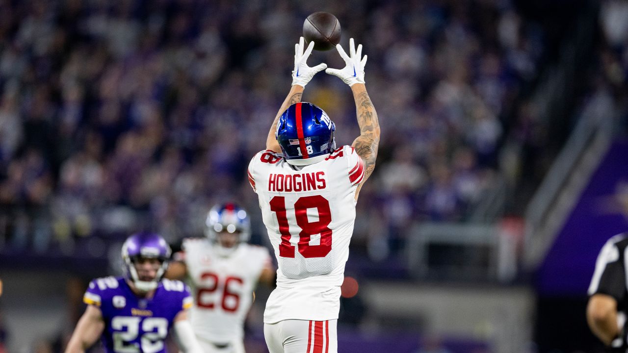 New York Giants wide receiver Isaiah Hodgins (18) runs with the ball  against the Washington Commanders during an NFL football game Sunday, Dec.  4, 2022, in East Rutherford, N.J. (AP Photo/Adam Hunger