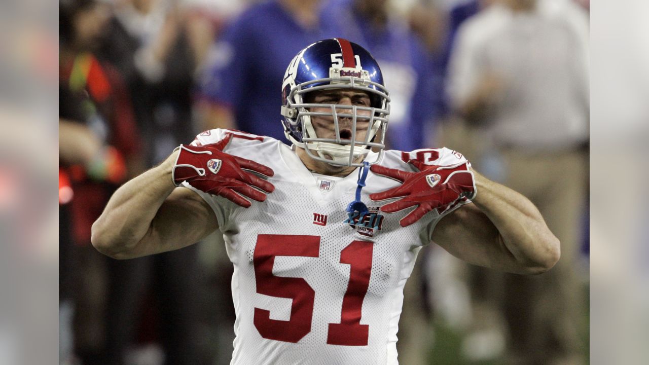 New York Giants defensive end Osi Umenyiora (72) applies pressure