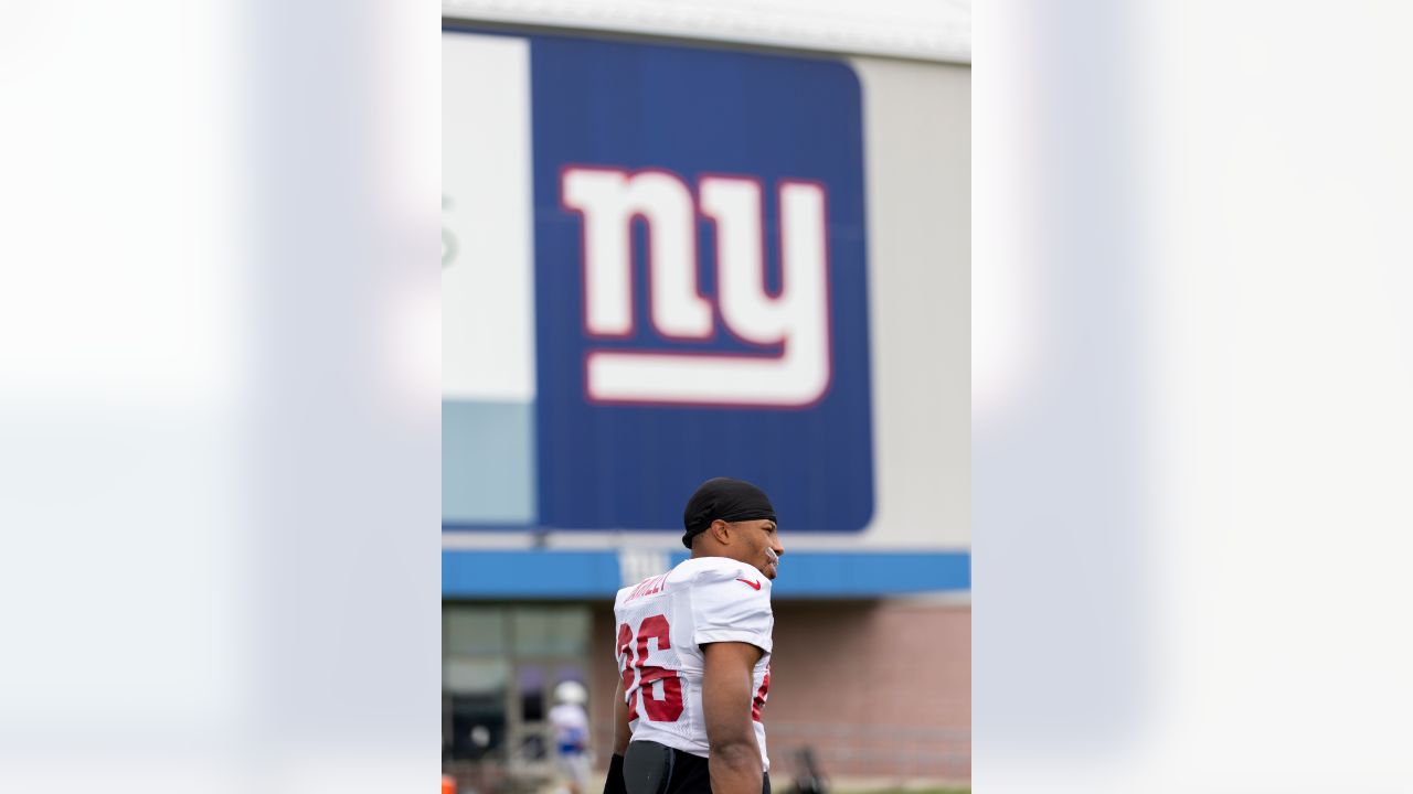 New York Giants tackle Evan Neal #73 walks off the field after their 31-27  loss to the New York Jets in an NFL pre-season football game, Sunday, Aug.  27, 2022, in East