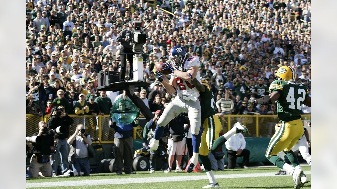 Green Bay Packers Jermichael Finley celebrates with Aaron Rodgers after he  catches an 12 yard touchdown pass in the first quarter against the New York  Giants in week 13 of the NFL