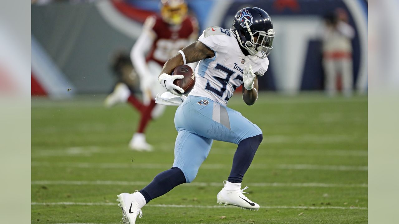 Tennessee Titans running back Dion Lewis (33) gets past Philadelphia Eagles  defensive back Malcolm Jenkins (27) in overtime of an NFL football game  Sunday, Sept. 30, 2018, in Nashville, Tenn. (AP Photo/Mark