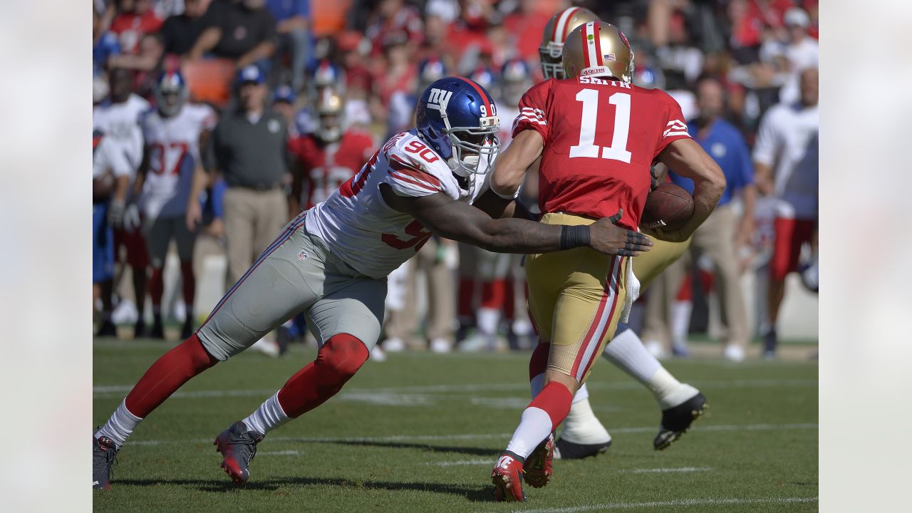 New York Giants defensive end jason Pierre-Paul stands over a fallen New  England Patriots quarterback Tom Brady during the fourth quarter at Super  Bowl XLVI at Lucas Oil Stadium on February 5