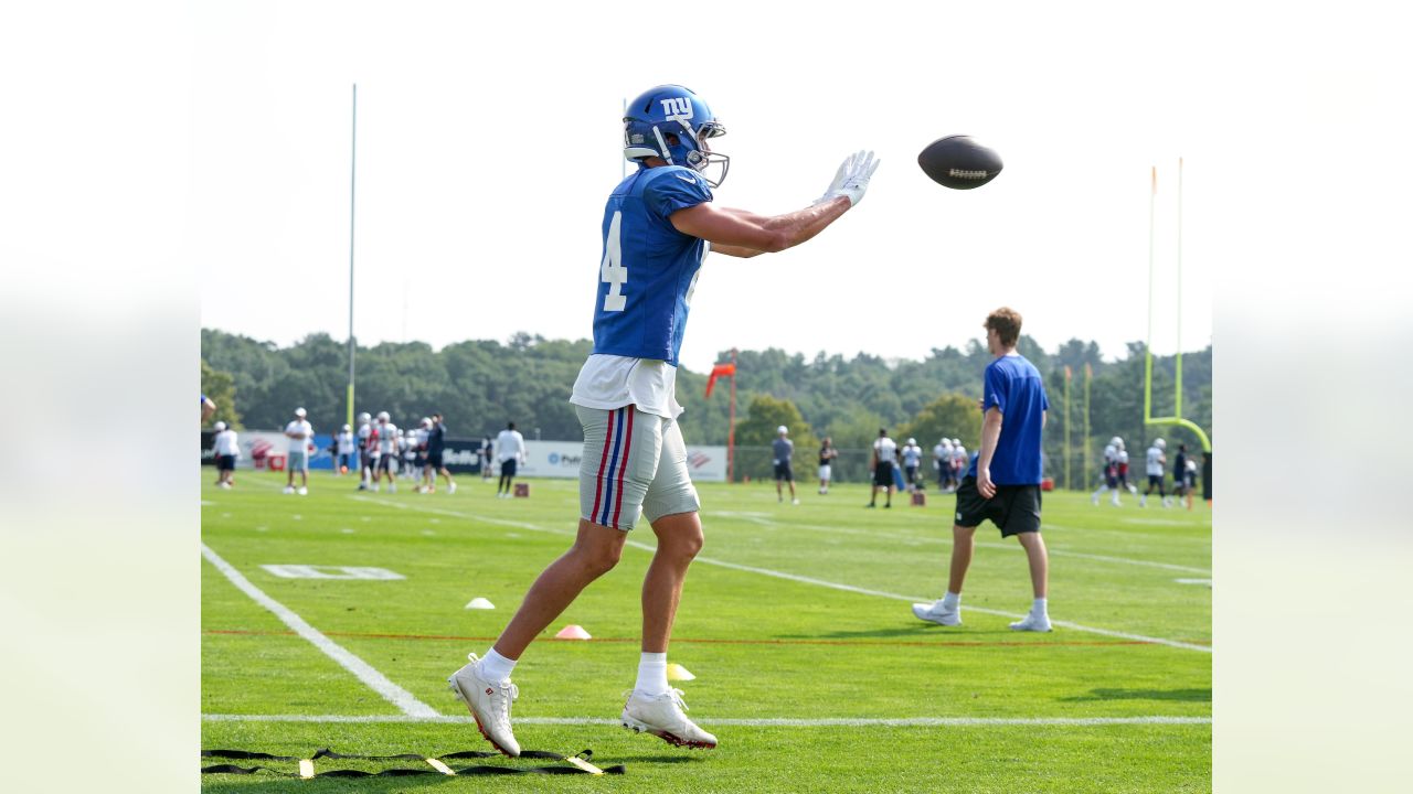 New York Giants running back Sandro Platzgummer makes a catch during a  joint NFL football practice with the New England Patriots, Thursday, Aug.  26, 2021, in Foxborough, Mass. (AP Photo/Steven Senne Stock