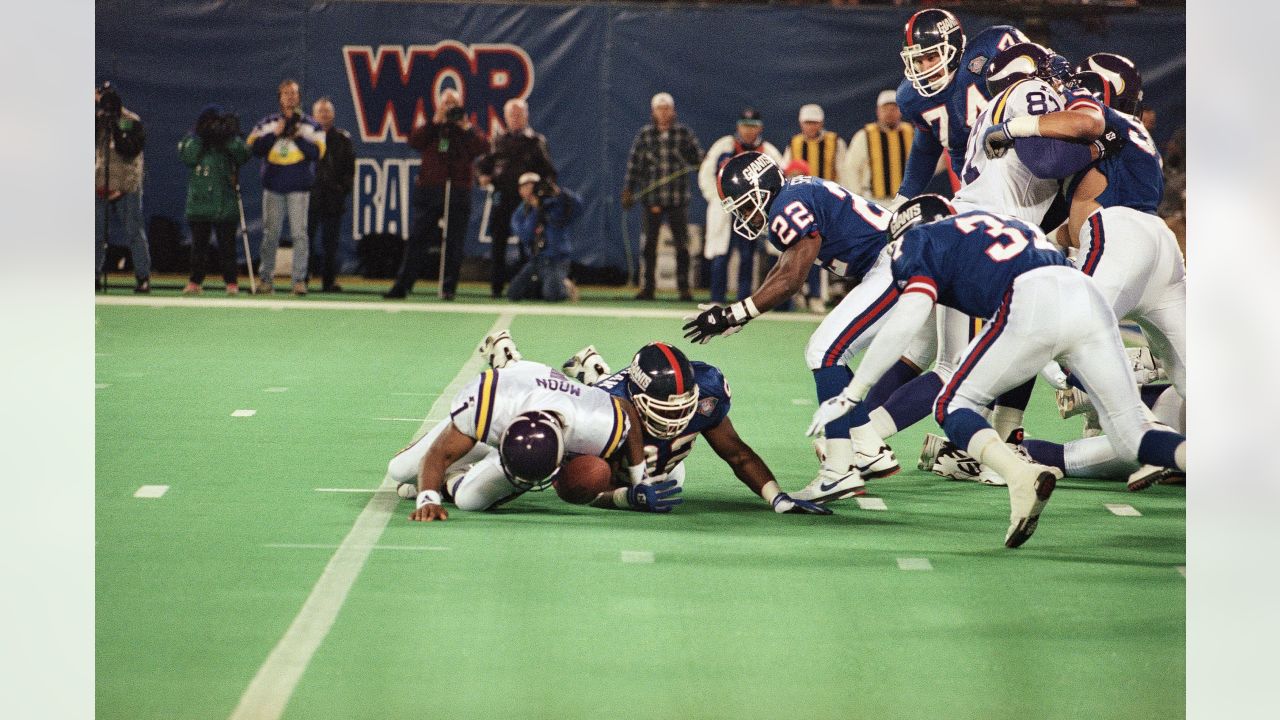 New England Patriots quarterback Matt Cavanaugh (12) is chased by  Pittsburgh Steelers linebacker Mike Merriweather (57) on his way to an  18-yard loss during the fourth quarter of their game in Pittsburgh