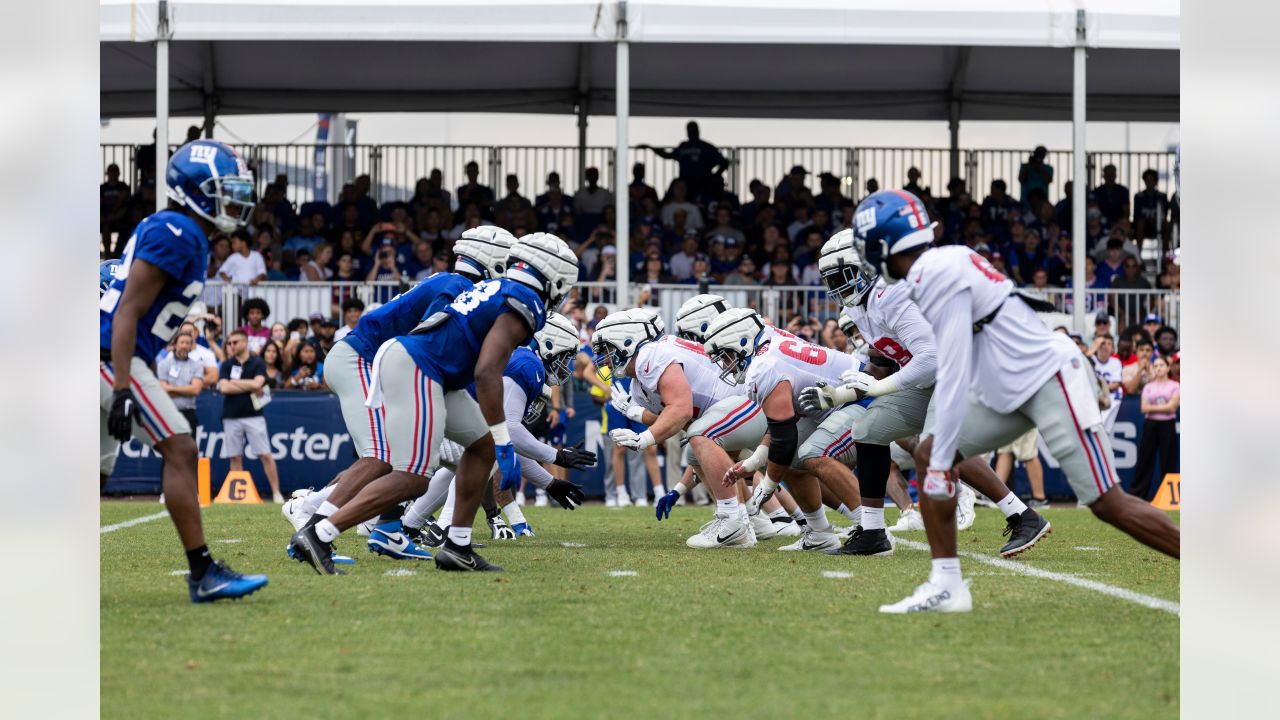 New York Giants tackle Evan Neal #73 walks off the field after their 31-27  loss to the New York Jets in an NFL pre-season football game, Sunday, Aug.  27, 2022, in East