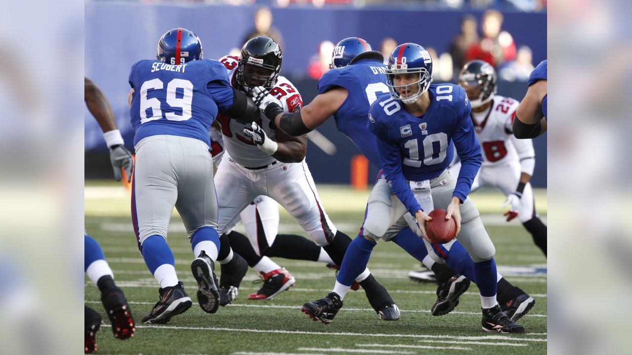 Atlanta Falcons James Sanders and Dunta Robinson (23) stand near New York  Giants Mario Manningham as he makes a 27 yard touchdown reception in the  fourth quarter in the NFC Wild Card