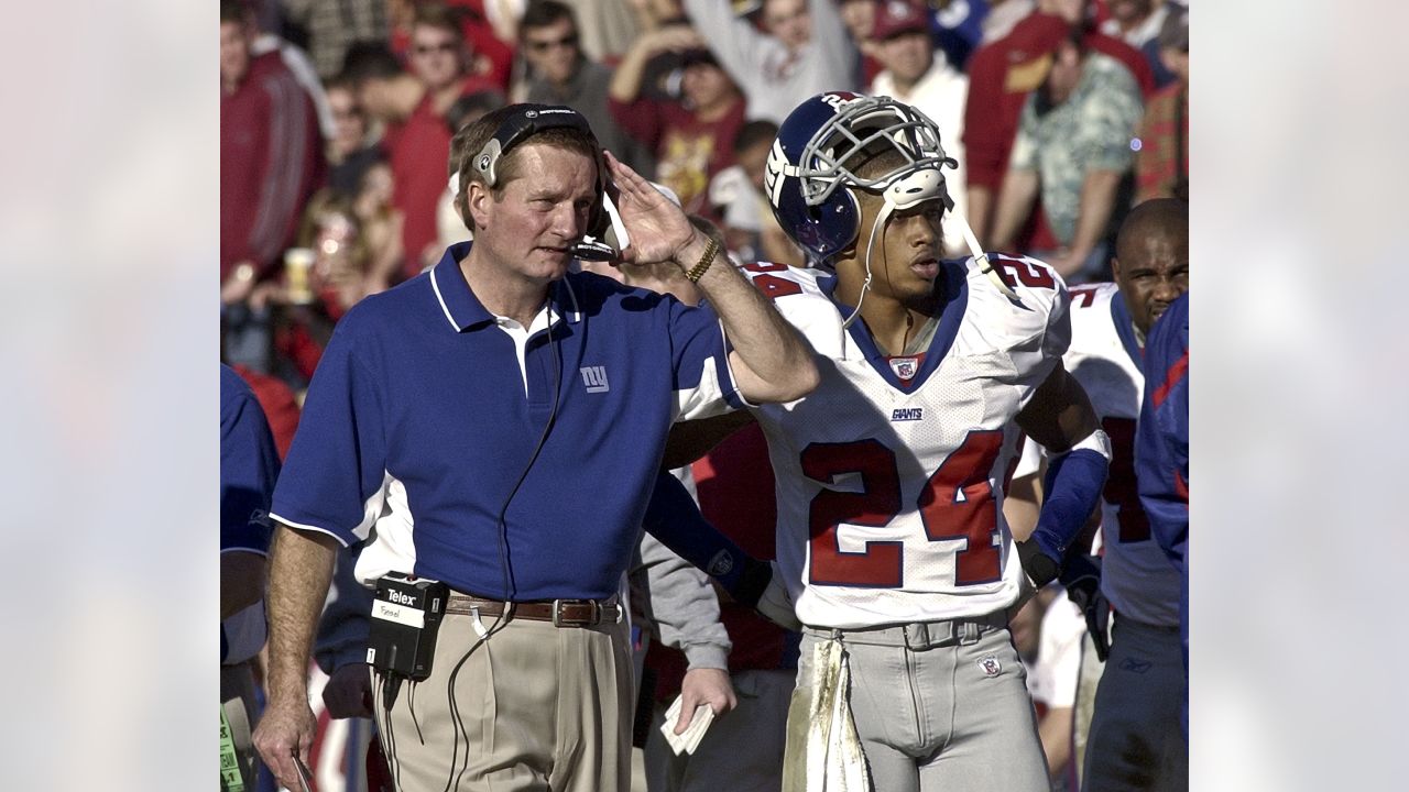 New York Giants head coach Jim Fassel wears his 2000 Super Bowl