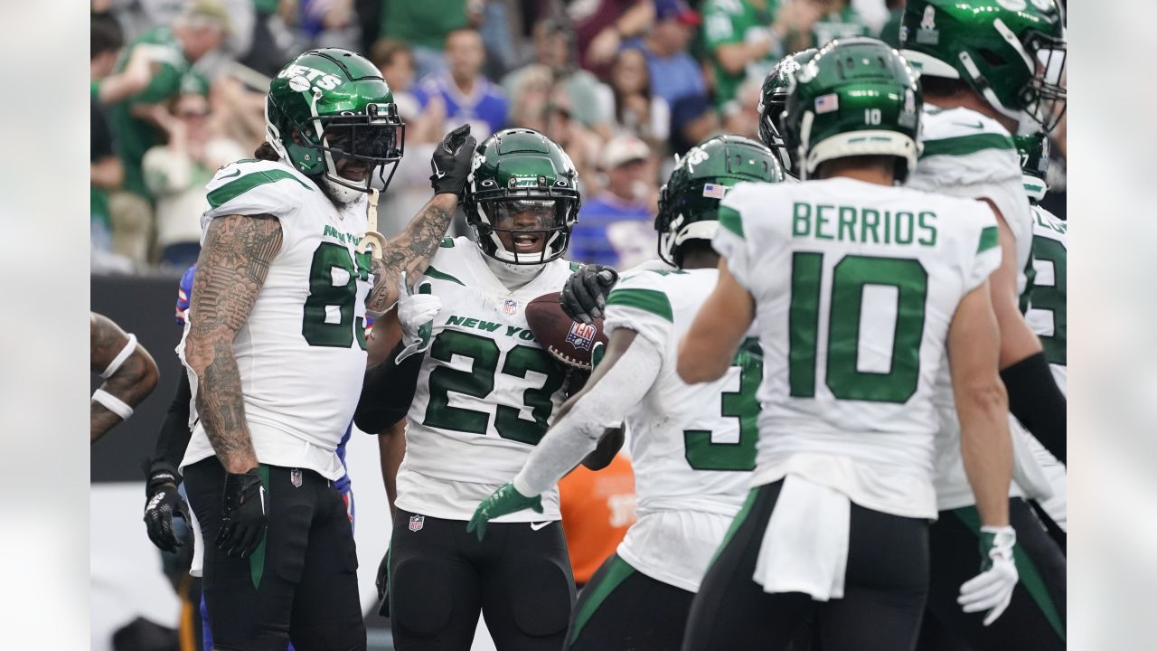 New York Jets' James Robinson (23) dives past Buffalo Bills' Tim Settle  (99) for a touchdown during the second half of an NFL football game,  Sunday, Nov. 6, 2022, in East Rutherford