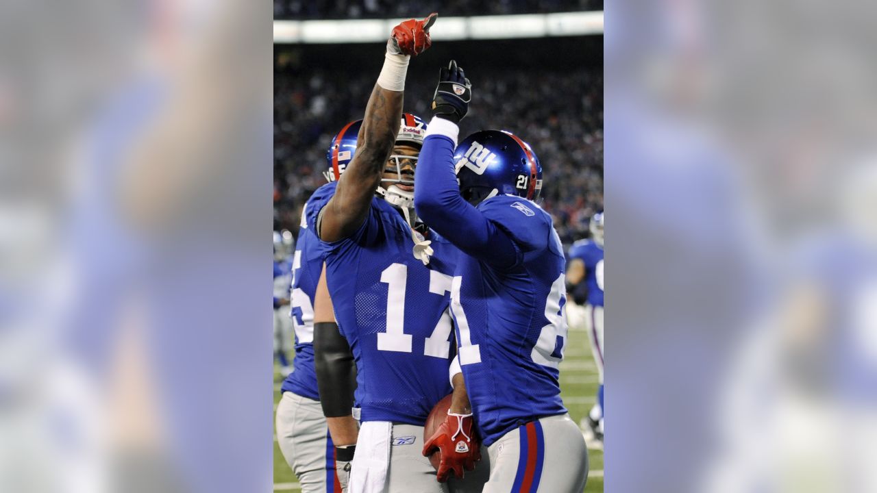 New England Patriots wide receiver Jakobi Meyers (16) bows as he celebrates  his touchdown in the end zone in the second half of an NFL football game  against the Detroit Lions, Sunday