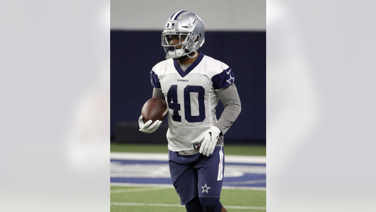 Dallas Cowboys defensive end Taco Charlton (97) watches the team work out  from the sideline at the team's NFL football training facility in Frisco,  Texas, Tuesday, June 11, 2019. (AP Photo/Tony Gutierrez