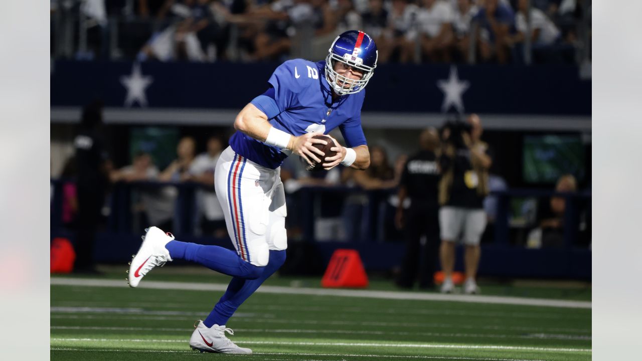 Dallas Cowboys' and Denver Broncos' kickers and other special-teams  players warm up prior to a National Football League game at the Cowboys'  home field AT&T Stadium in Arlington, Texas