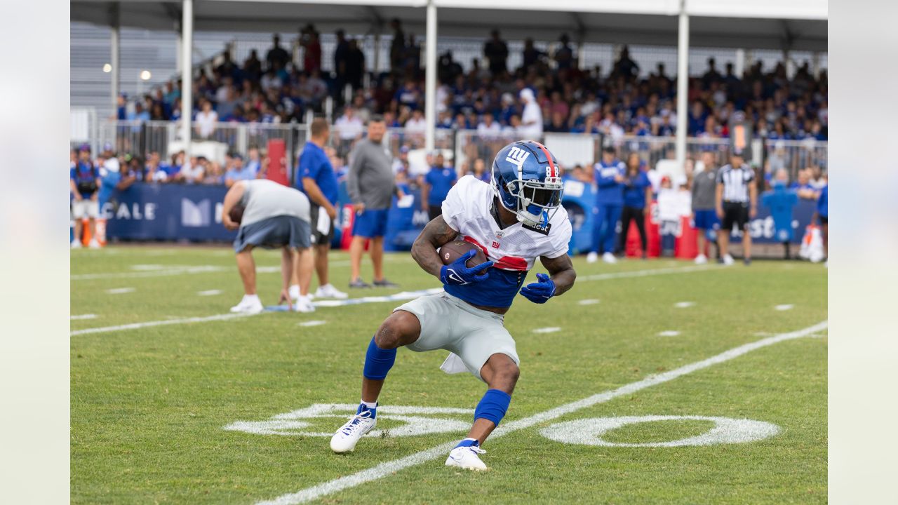 New York Giants tackle Evan Neal #73 walks off the field after their 31-27  loss to the New York Jets in an NFL pre-season football game, Sunday, Aug.  27, 2022, in East