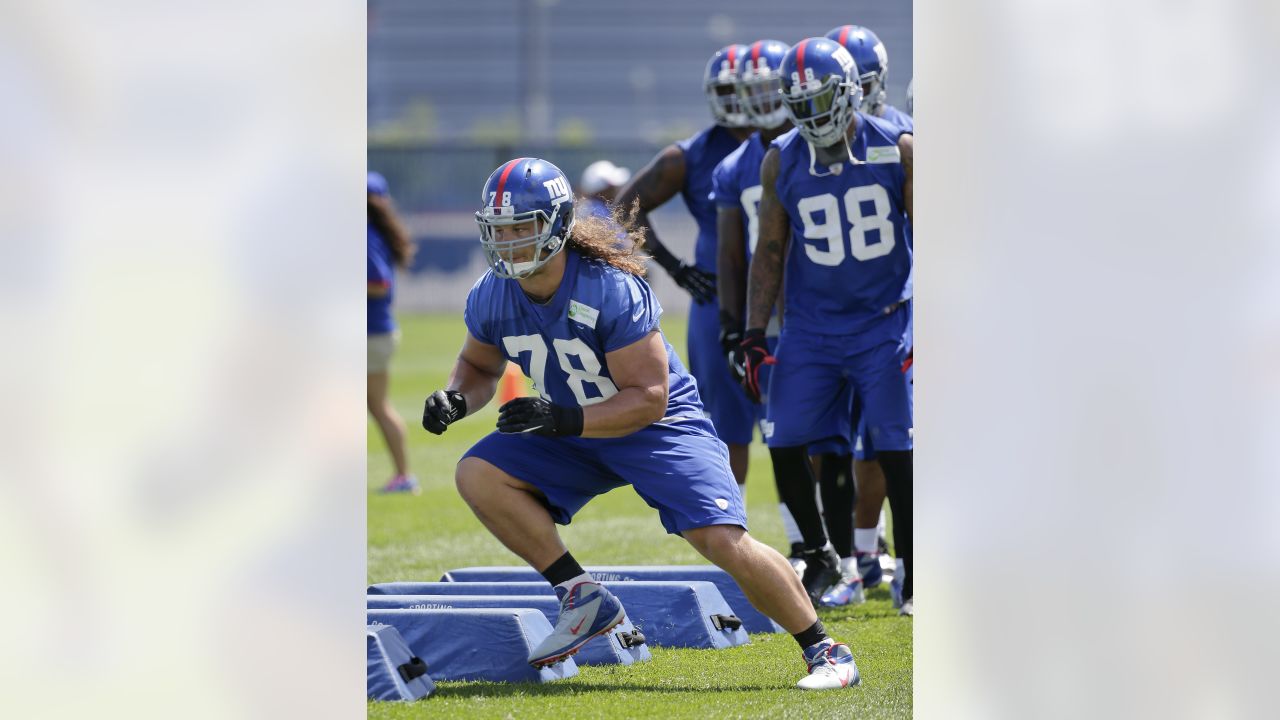 New York Giants defensive tackle Markus Kuhn (78) is fired up after an  interception by a teammate in an NFL football game between the New York  Giants and Dallas Cowboys on Sunday