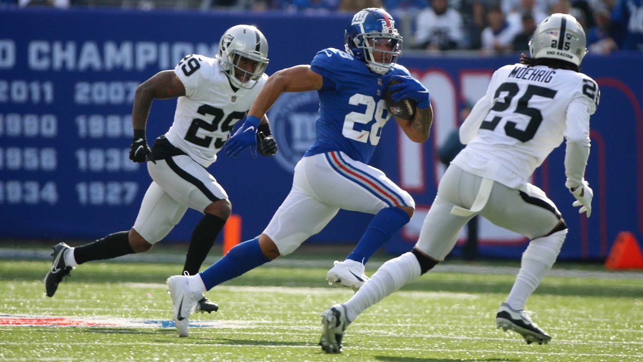 Las Vegas Raiders' Tyree Gillespie (37) tackles New York Giants' Pharoh  Cooper (83) during the …