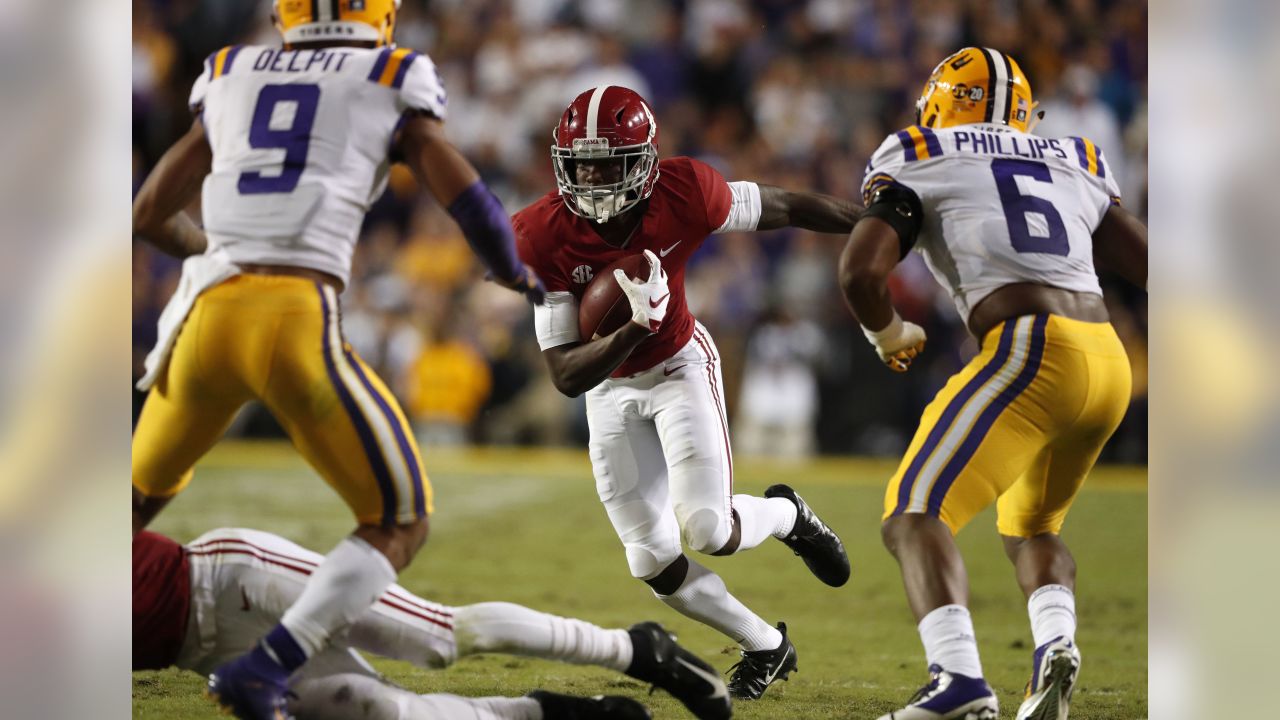 Alabama's Josh Jacobs (8) celebrates his touchdown run against Louisville  with teammates, including wide receiver Jerry Jeudy (4), during the second  half of an NCAA college football game Saturday, …